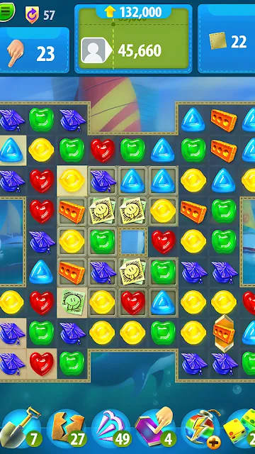 A gummy board with resource counters above it and a row of boosters underneath